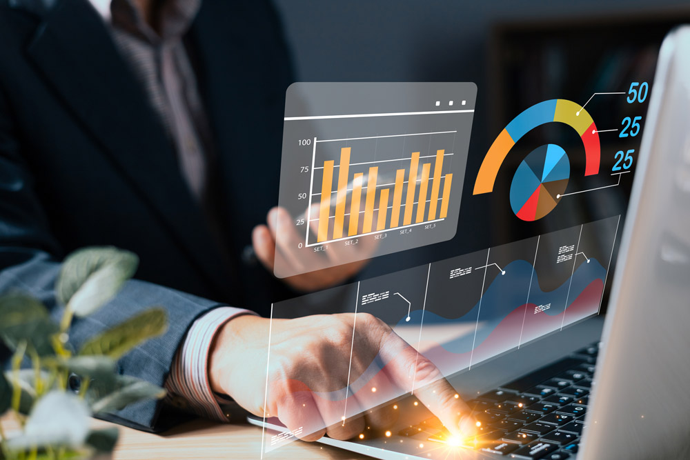 man use laptop with growth graphs and progress of business and a